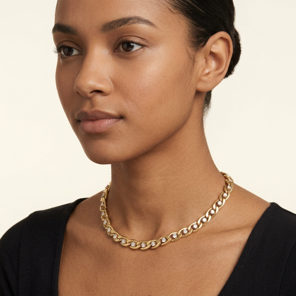 Close-up head-and-neck portrait wearing the gold crystal choker